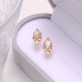 Geometric 925 silver ear studs with natural white crystal accents on simple background