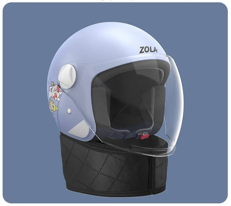 Blown Away winter cycling helmet with attached fleece scarf and clear anti-fog visor on a handlebar.