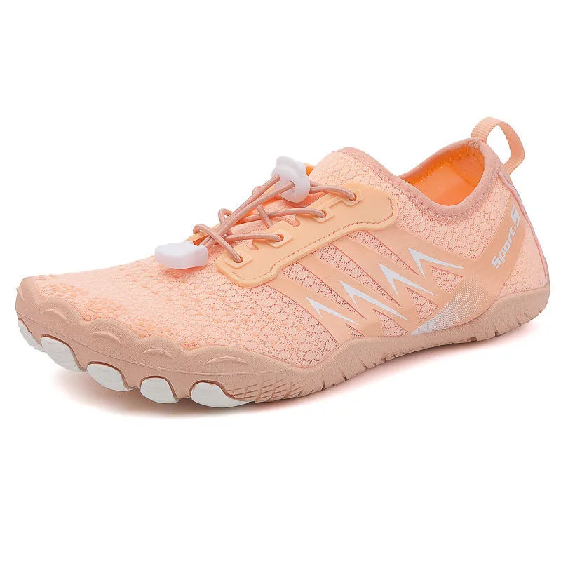 Low-top river tracing shoes in apricot colour with mesh upper and rubber sole.