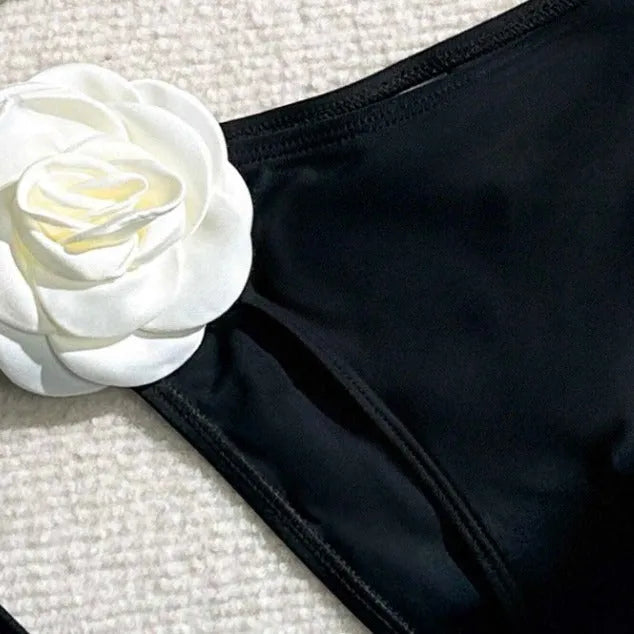 Black two-piece bikini with 3D flower lace detail and a split backless briefs design.