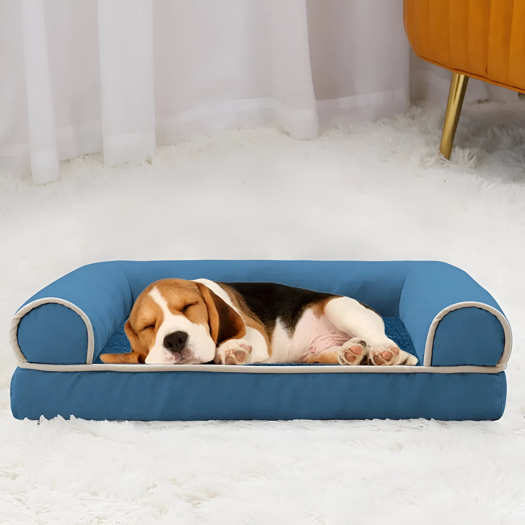 Square dark grey dog bed with raised sponge sides on a wooden floor, showing breathable cloth texture.
