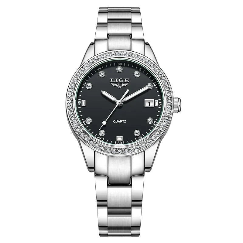 Silver stainless steel women's watch with diamond-encrusted bezel and luminous hands on a 34mm round dial.