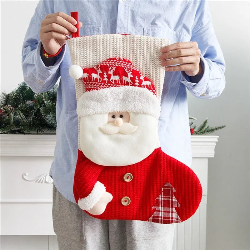 Large red and white knitted Christmas stocking with Santa Claus design for fireplace mantel decoration
