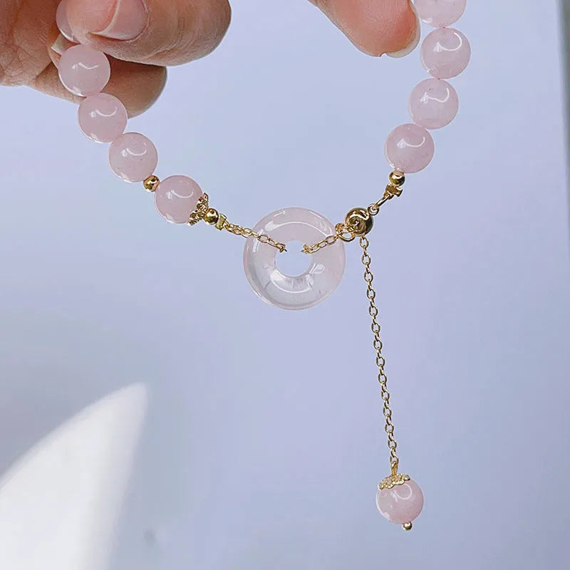 Pink crystal peace buckle bracelet on adjustable silver-plated chain for women