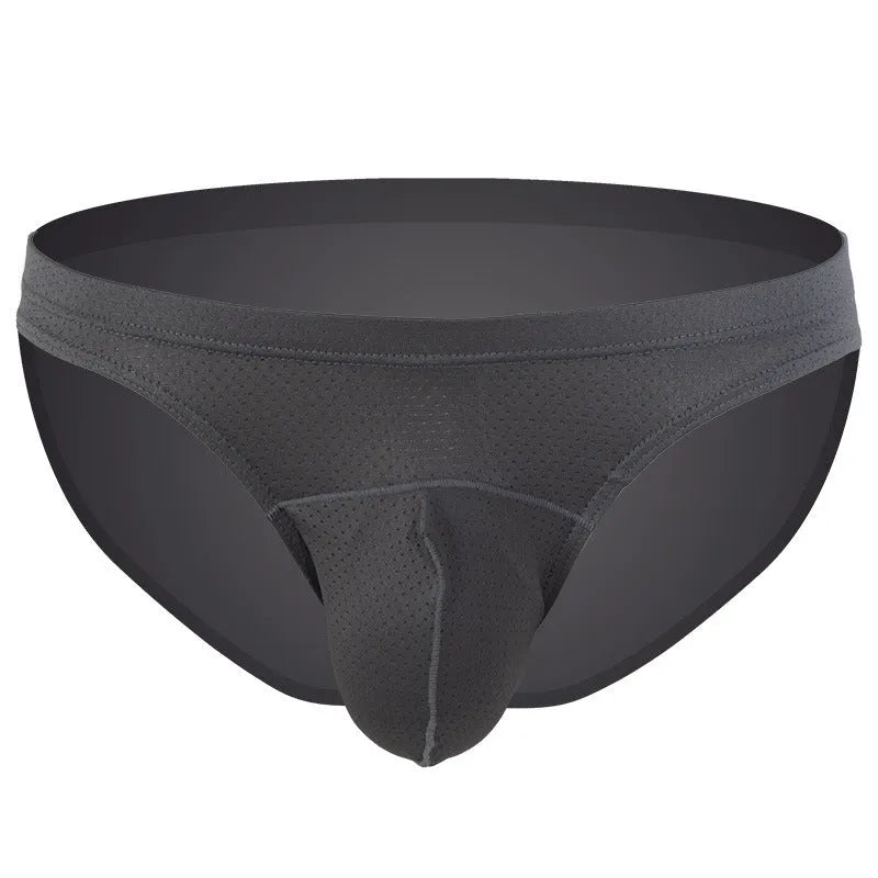 Men's loose-fitting light blue nylon boxer shorts laid flat on a surface