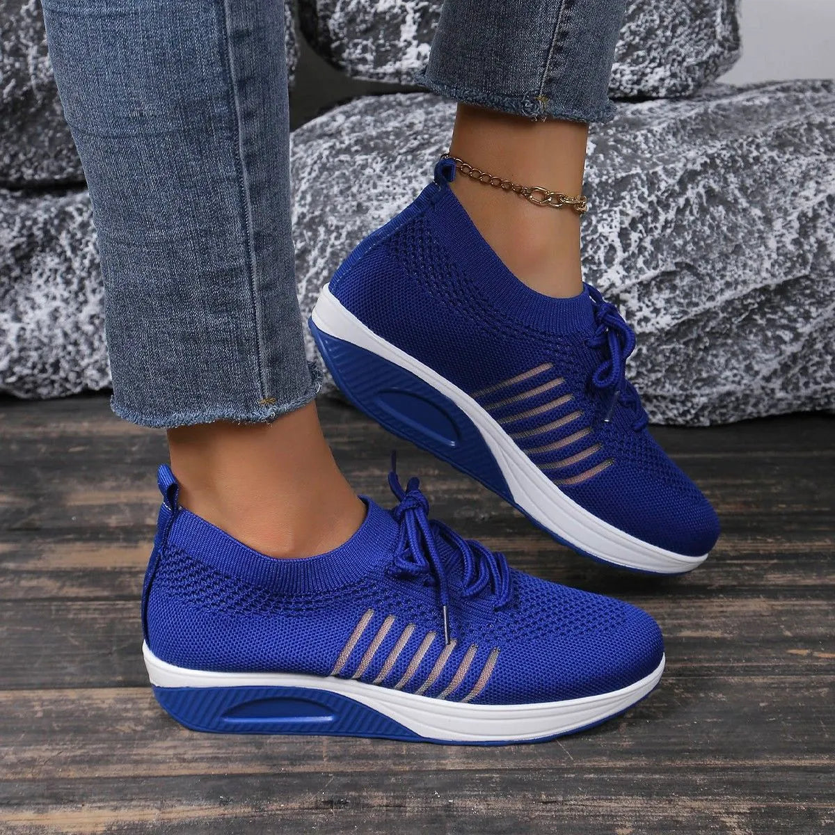 Women's lace-up flat shoes with mesh upper and platform heel in black, dark blue, or red colour options