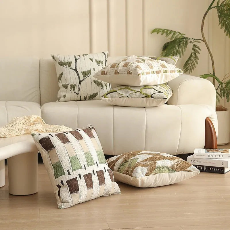 Square 45cm jacquard cushion cover with retro floral pattern in Nordic style on a grey sofa.