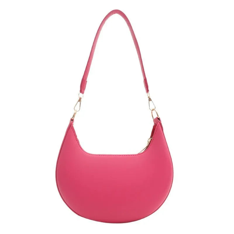Round green one-shoulder underarm bag with visible sewing lines and sandwich-style compartments