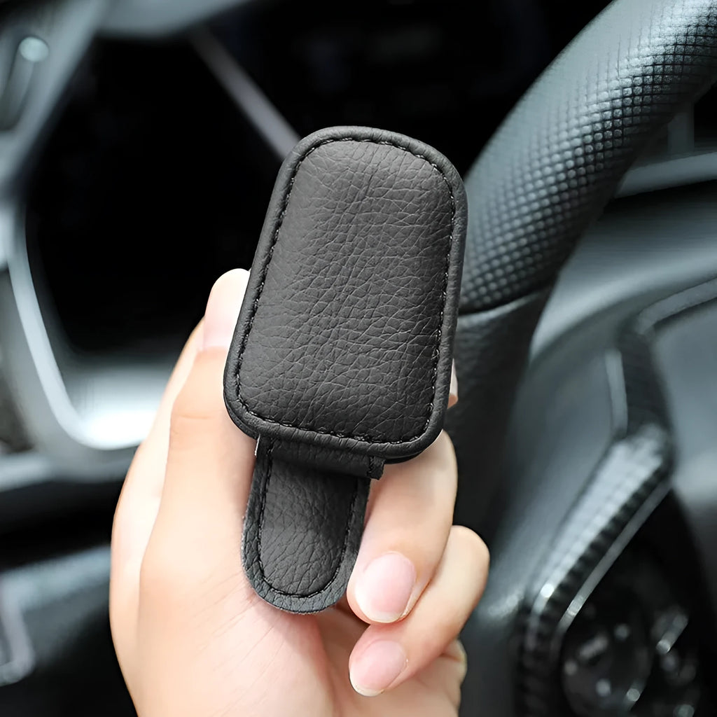 PU leather car sunglasses holder clip attached to a sun visor in beige colour