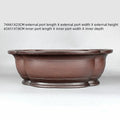 Handmade antique crabapple shaped purple clay flowerpot for plants.