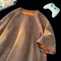 A man's loose fit ripped t-shirt in khaki colour with a round neck and short sleeves.