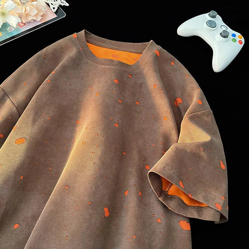 A man's loose fit ripped t-shirt in khaki colour with a round neck and short sleeves.