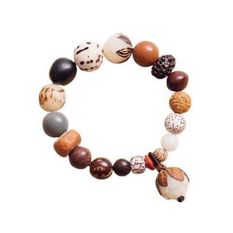 Handmade brown Bodhi seed bead bracelet with geometric design on a 16cm wrist.