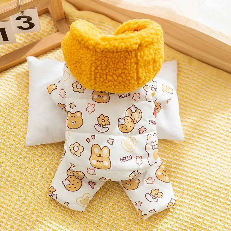 Yellow quilted cotton four-legged dog coat with sherpa hood and bear print on white background