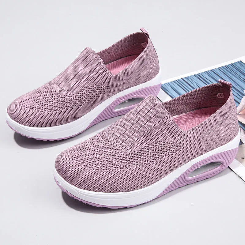 Women's mesh running shoes with air cushion sole in beige colour showing round toe and elastic lace design