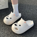 Women's white EVA foam sandal slippers with toe cap design on wooden floor