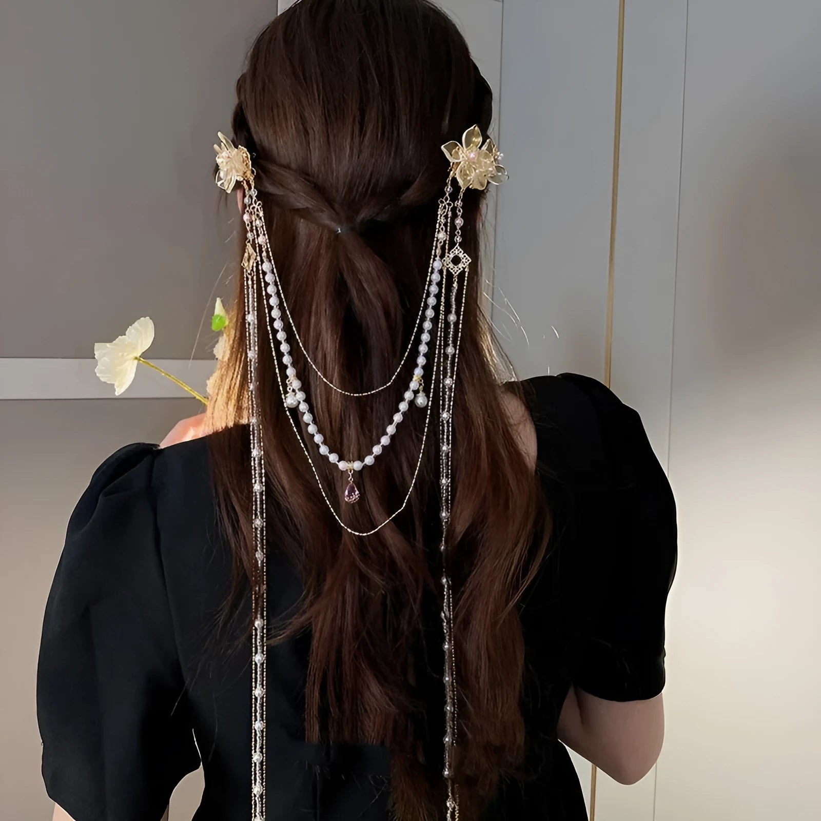 Gold-coloured women's hairpin with acrylic flower design featuring pearl, diamond, and long tassel decorative elements