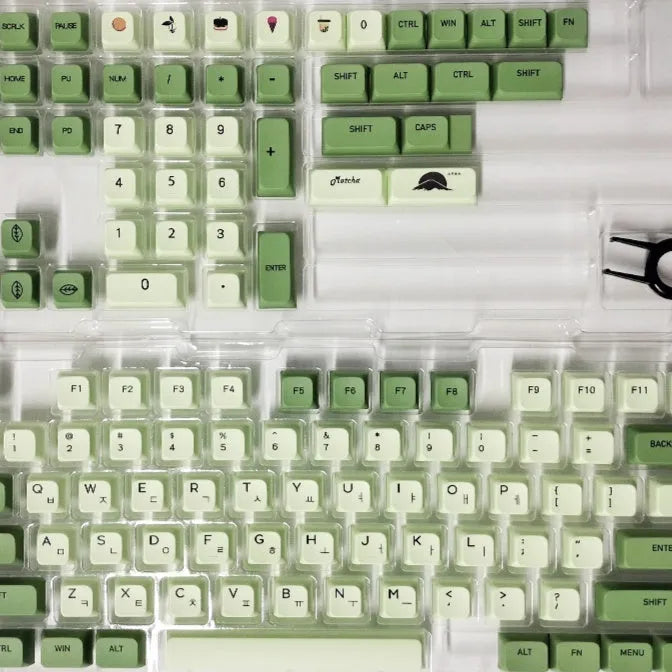 124 PBT dye-sublimation keycap set in matcha green colour on a keyboard.