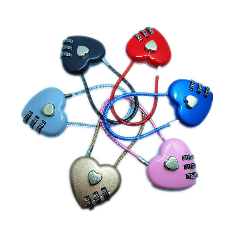 Peach heart-shaped wire rope padlock with a coiled steel cable, shown in various colours.