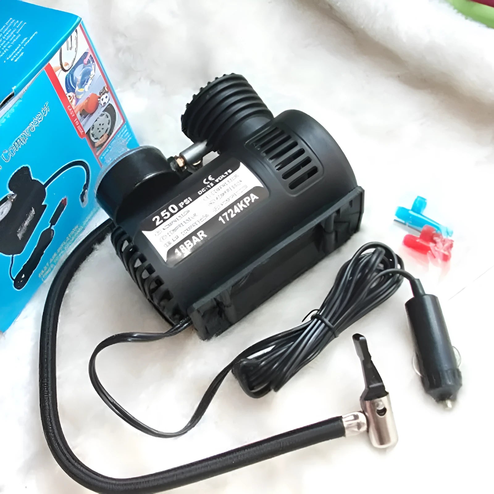 Black 12V mini portable car tyre air pump with dimensions 13.5 by 12 by 7 centimetres.