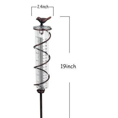 Cast iron outdoor garden rain gauge with hummingbird decoration and measurement scale.