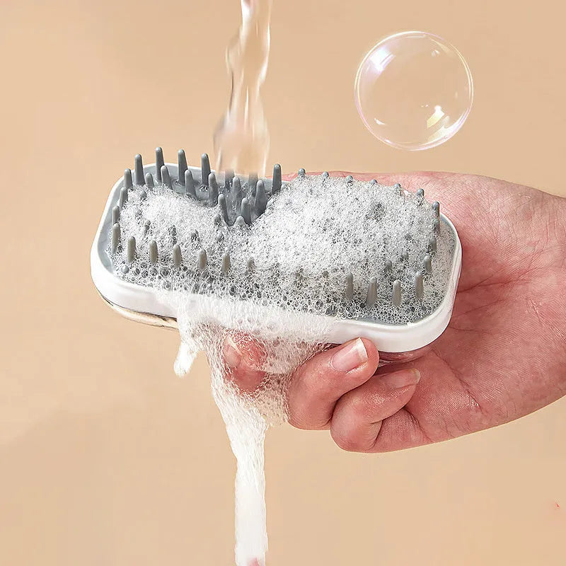 Grey and pink silicone pet bath brush with detachable head for dogs and cats.