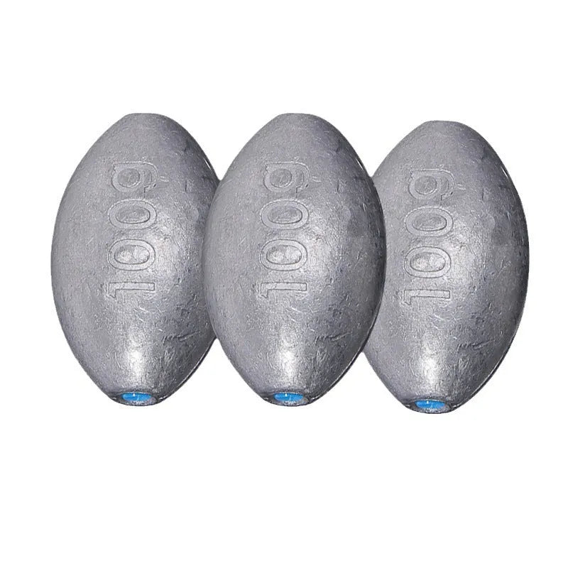Close-up of a grey olive-shaped lead fishing sinker with scale texture, showing the central hole for rigging.