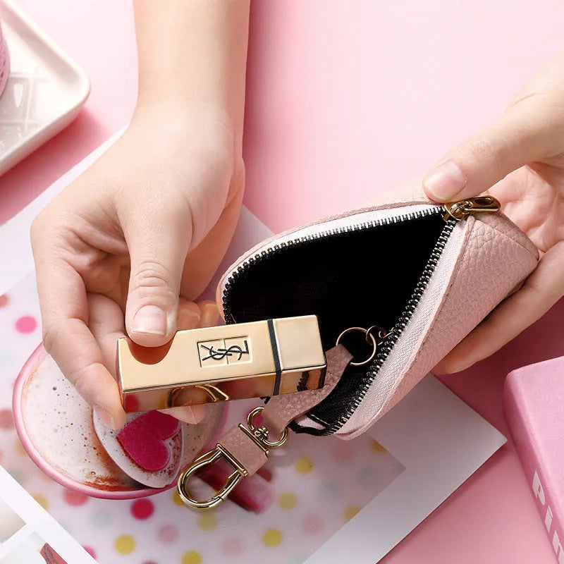 Black pu leather key case with silver zipper closure showing key ring inside