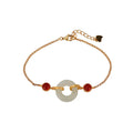 Gold-coloured women's bracelet with a silver base and an inlaid Hetian jade peace buckle charm.