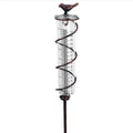 Cast iron outdoor garden rain gauge with hummingbird decoration and measurement scale.
