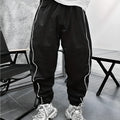 Men's loose fit cropped casual trousers in bamboo fibre, shown in army green colour.