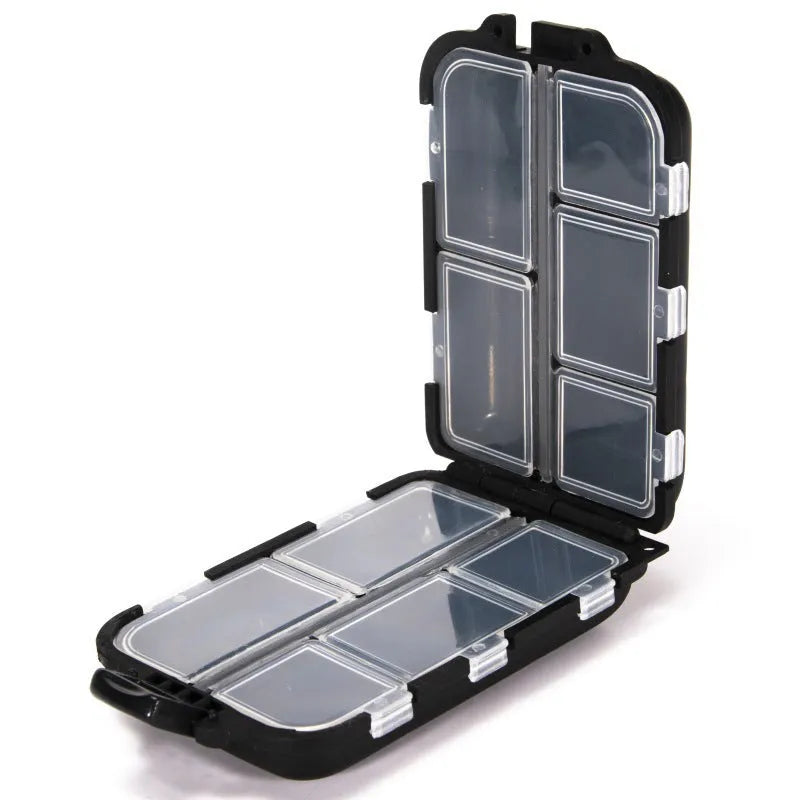 Black plastic fishing tackle storage box with 10 internal compartments, shown next to a ruler.