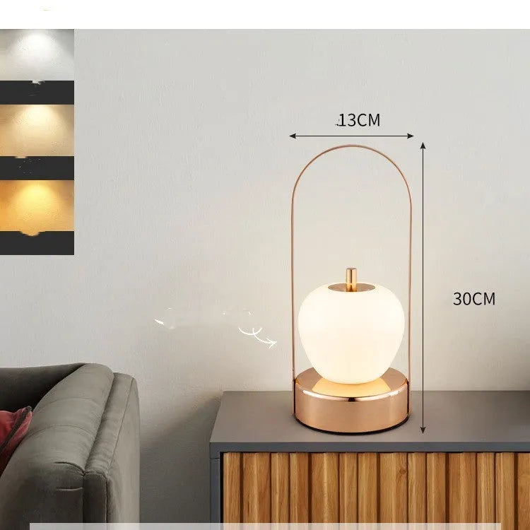 Rechargeable bedside table lamp with metal holder, golden, portable for camping and emergency use, USB charging