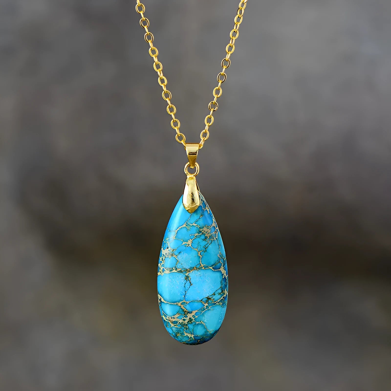 Emperor Stone water drop shaped jade pendant necklace with 18K gold plating on a chain.
