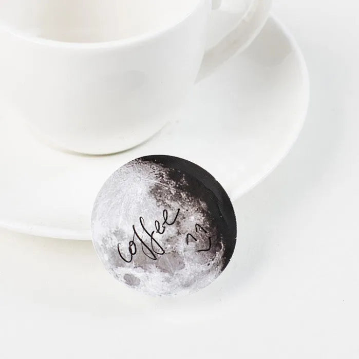Boxed set of 45 black moon phase and calendar planet hand account stickers.