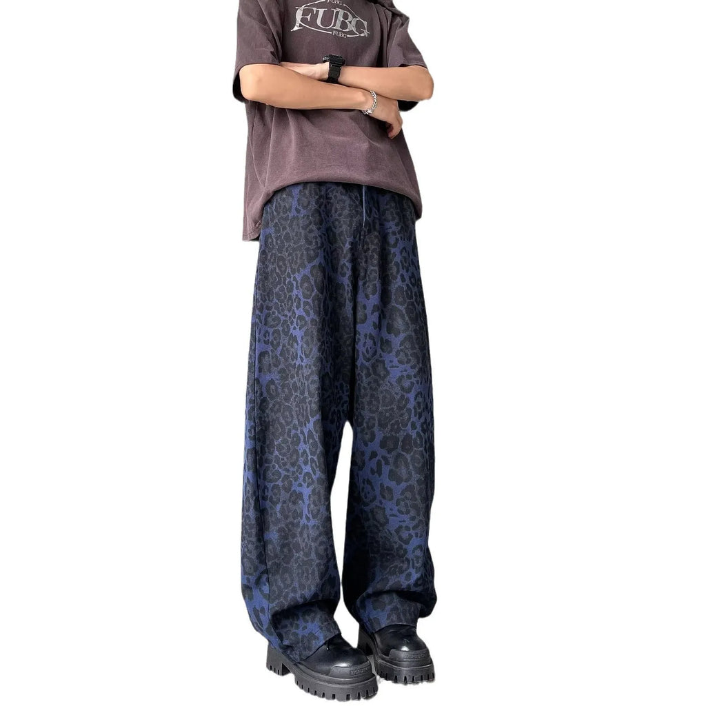 Blue cotton leopard print wide-leg pants with zip fly, full-length view