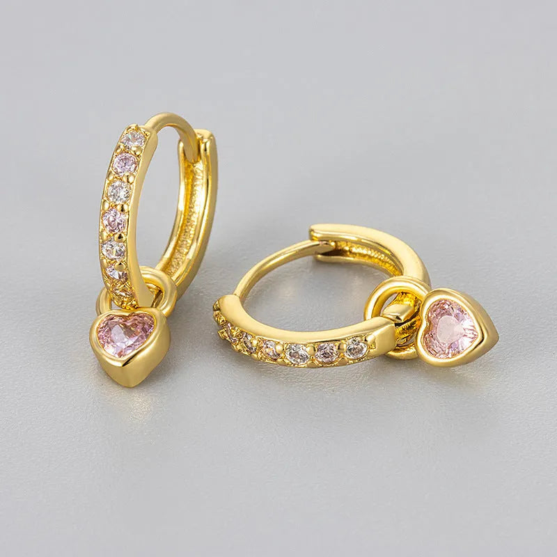 Gold-coloured clip-on earring for women with a heart-shaped drop featuring a pink zircon stone.