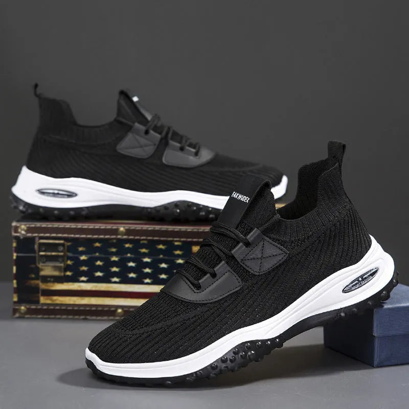 Low-top Flyknit sports trainer in black with mesh lining and lace-up front, shown on a white background.