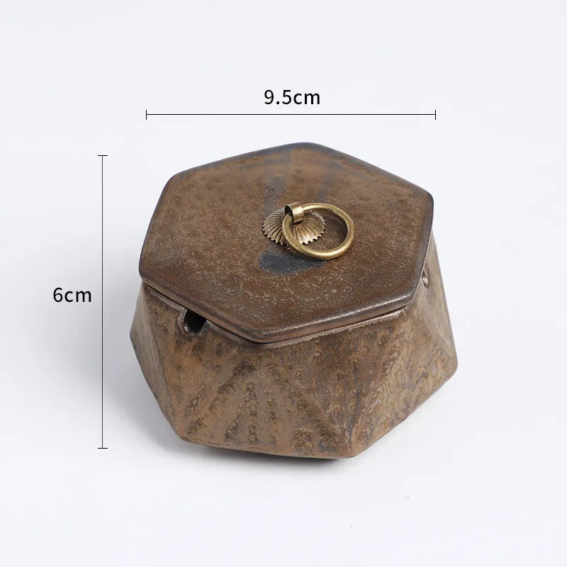 Ceramic ashtray with lid, Nordic style, available in multiple colours, on a tabletop