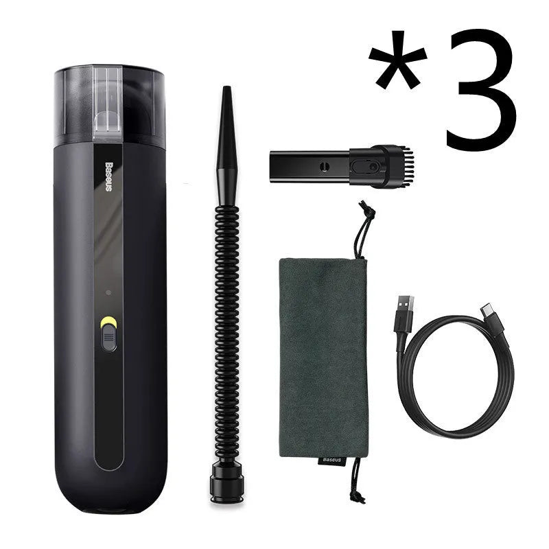 Starry sky black handheld car vacuum cleaner with a blowing hose attachment on a car seat.