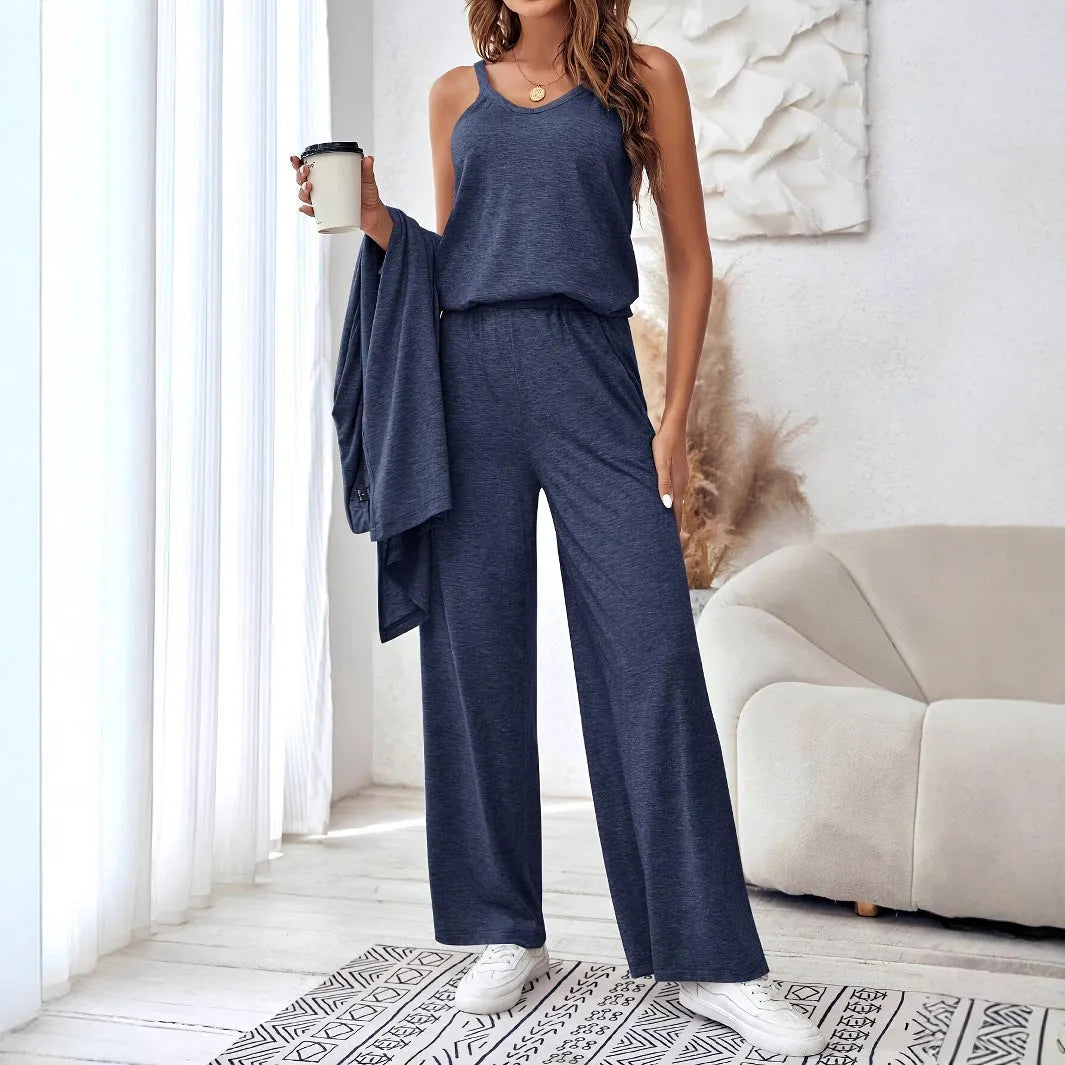 Blue women's three-piece casual suit with sling top, cardigan, trousers, and suspenders.