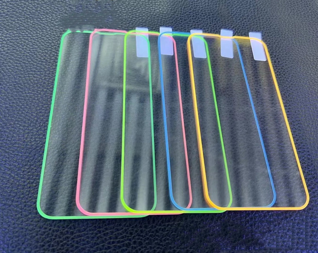 Fluorescent blue tempered glass screen protector glowing on an iPhone 13 in a dark setting.