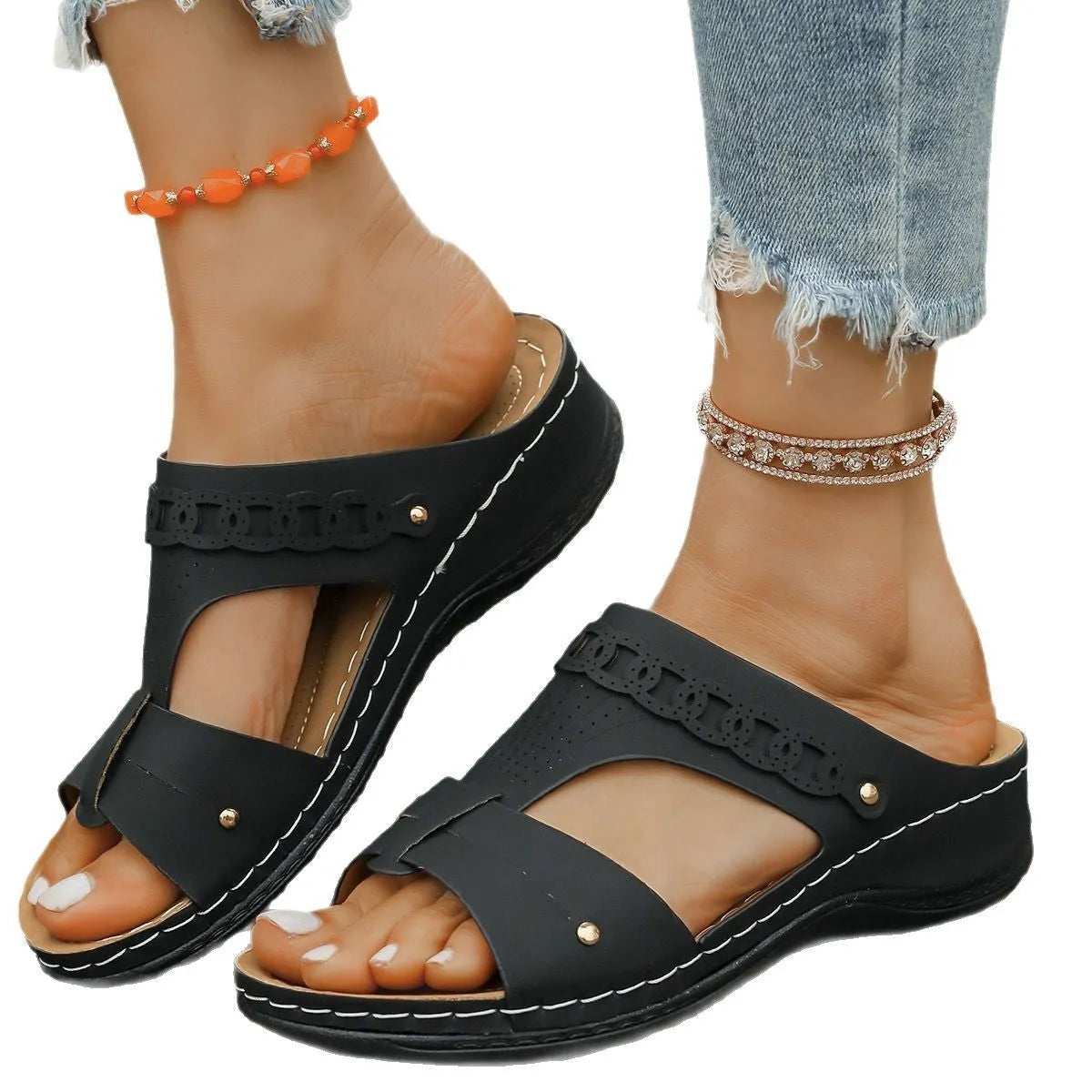 Blue Roman style casual slippers with a slope heel and fish mouth toe holder on a rubber sole.