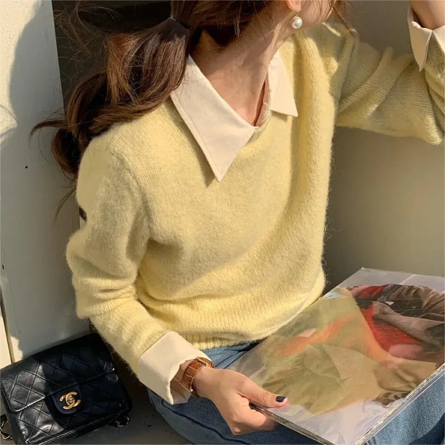 Women's loose knitwear top in navy blue with long sleeves and solid colour design