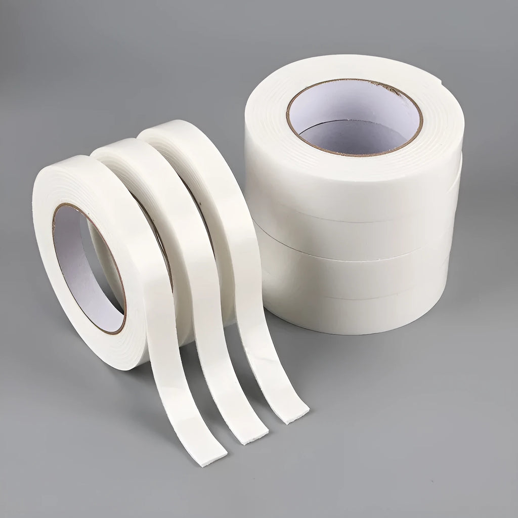 Roll of white foam double-sided adhesive tape showing its 3mm thickness and strong adhesive.