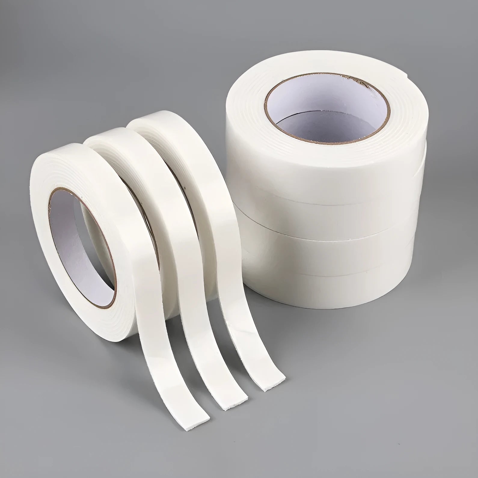 Roll of white foam double-sided adhesive tape showing its 3mm thickness and strong adhesive.