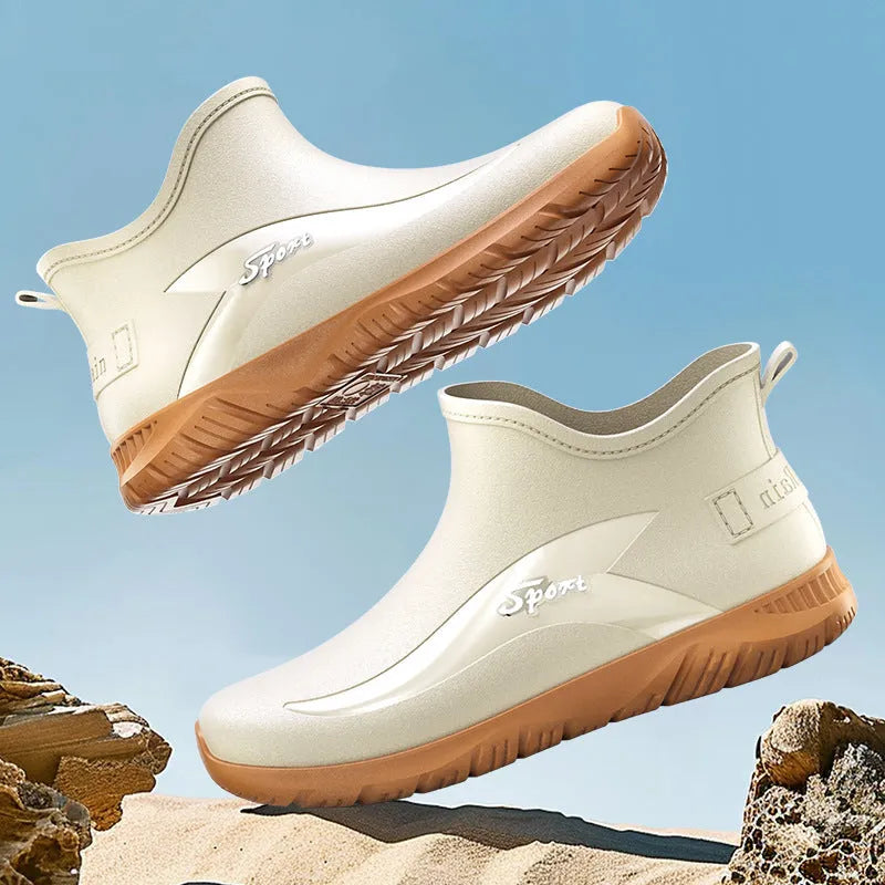 Men's short PVC rubber boots in beige with a flat heel and non-slip sole.