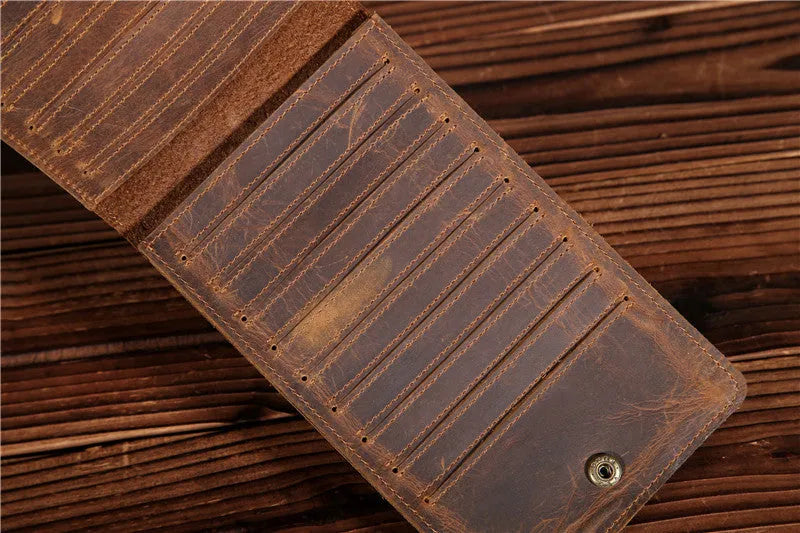 Men's long leather card wallet in crazy horse hide with 18 card slots and a phone compartment.