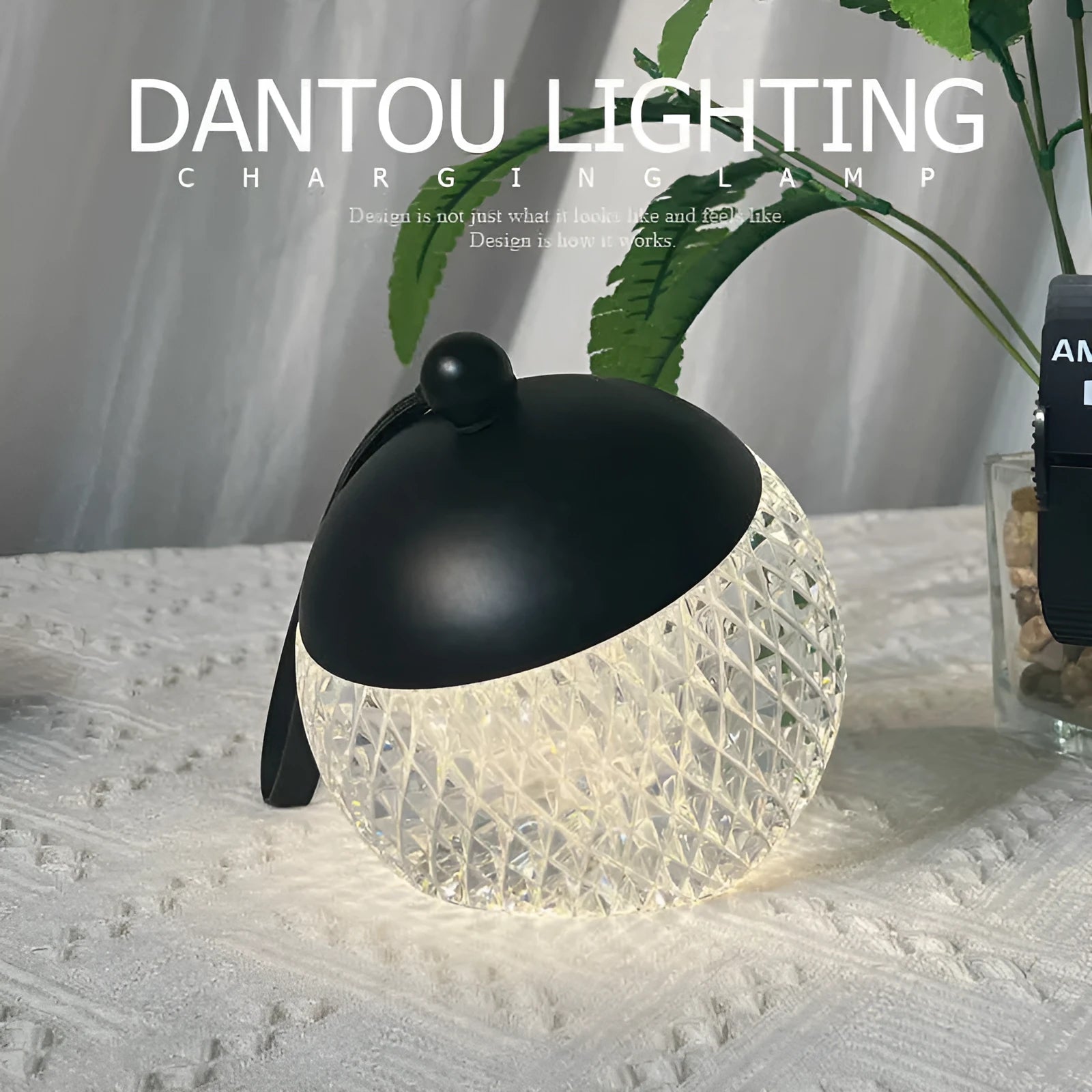 Portable cylindrical night lamp with touch control in metallic finish on wooden table