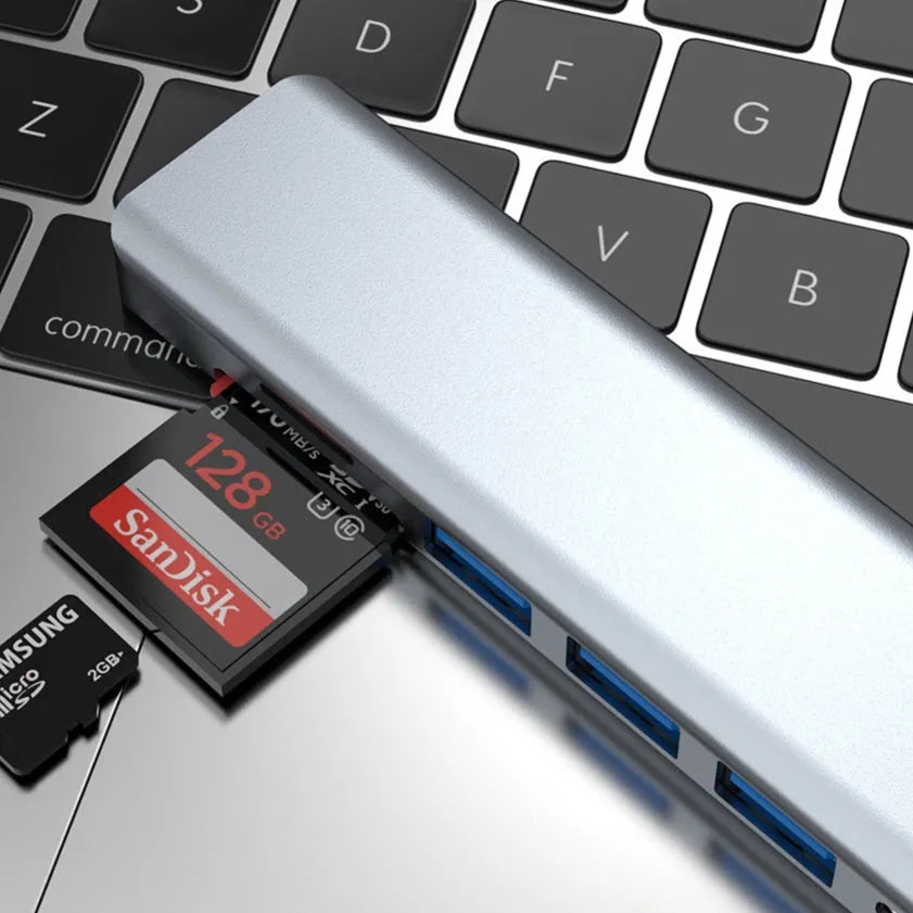 Seven-in-one Type-C USB expander hub with a short cable on a desk